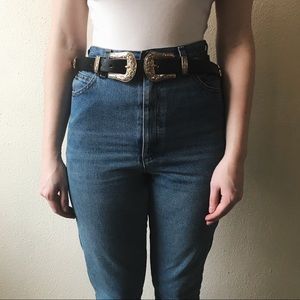 Gold double buckle belt.